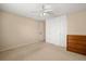 Bedroom with neutral paint, a ceiling fan and carpet at 720 S Clinton St # 1B, Denver, CO 80247