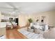 Stylish living space with hardwood floors, a ceiling fan, and a dining area with contemporary decor at 720 S Clinton St # 1B, Denver, CO 80247