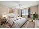 This main bedroom has beautiful natural light, neutral color scheme, and a ceiling fan at 720 S Clinton St # 1B, Denver, CO 80247