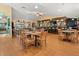 Restaurant with tables, chairs, and a well-stocked bar for a relaxing dining experience at 720 S Clinton St # 1B, Denver, CO 80247