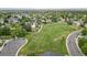 Beautiful aerial view showcasing the lush green space, walking path, and homes in this desirable neighborhood at 13341 Birch Cir, Thornton, CO 80241