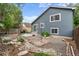 Well-maintained backyard featuring a patio, landscaping, and attractive home exterior at 13341 Birch Cir, Thornton, CO 80241