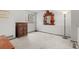 Finished basement area with neutral carpeting and a large window at 13341 Birch Cir, Thornton, CO 80241