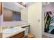 Cozy bathroom features a single sink vanity with toilet and shower stall at 13341 Birch Cir, Thornton, CO 80241