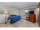 Bright bedroom featuring a large window, ample closet space, and neutral carpet at 13341 Birch Cir, Thornton, CO 80241