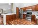 A bright kitchen featuring stainless steel appliances and wood cabinets at 13341 Birch Cir, Thornton, CO 80241