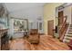 Bright living room featuring hardwood floors, fireplace, and lots of natural light at 13341 Birch Cir, Thornton, CO 80241