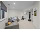 Basement lounge with sectional, window, and unique decor at 1126 S Davenport Ct, Erie, CO 80516