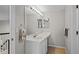 Cozy bathroom with a long vanity area, large mirror and storage beneath with tile floors at 1126 S Davenport Ct, Erie, CO 80516
