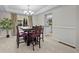 Inviting dining room with a chandelier, hardwood table, and access to the kitchen at 1126 S Davenport Ct, Erie, CO 80516