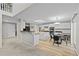Spacious kitchen with a butcher block island, and stainless steel appliances open to living area at 1126 S Davenport Ct, Erie, CO 80516