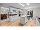 Bright kitchen featuring white cabinetry, a butcher block island, and stainless steel appliances at 1126 S Davenport Ct, Erie, CO 80516