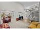 Open living space featuring plush carpet, wood-like floors, and access to the dining area at 1126 S Davenport Ct, Erie, CO 80516