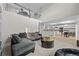 Bright, open living room with soaring ceilings and modern decor flowing into a well-equipped kitchen at 1126 S Davenport Ct, Erie, CO 80516