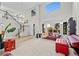 Bright, open-concept living room with two-story ceilings, large windows, and a staircase at 1126 S Davenport Ct, Erie, CO 80516