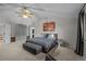 Comfortable main bedroom with vaulted ceilings, ceiling fan, storage and decorative city artwork at 1126 S Davenport Ct, Erie, CO 80516