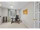 Bright office space with modern light fixture, neutral walls, and dark wood desk at 1126 S Davenport Ct, Erie, CO 80516