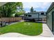 Backyard featuring a well maintained lawn, fire pit, RV parking and a grill at 5986 Dunraven St, Golden, CO 80403