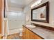 Well-lit bathroom with a shower/tub combo, modern vanity, and neutral decor at 5986 Dunraven St, Golden, CO 80403
