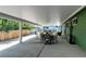 Covered patio offering ample space for dining and relaxation with trailer parking close by at 5986 Dunraven St, Golden, CO 80403