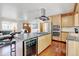 Stylish kitchen with stainless steel appliances, a wine cooler, and an island cooktop perfect for cooking at 5986 Dunraven St, Golden, CO 80403