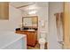 Laundry room featuring a sink, counter, and modern washer and dryer at 5986 Dunraven St, Golden, CO 80403
