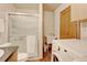 Laundry room includes a utility sink, shower and new washer and dryer at 5986 Dunraven St, Golden, CO 80403