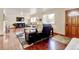 Bright living room featuring a fireplace, hardwood floors, and lots of natural light at 5986 Dunraven St, Golden, CO 80403