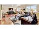 Cozy living room with hardwood floors, large windows, and a comfortable seating area at 5986 Dunraven St, Golden, CO 80403