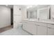Modern bathroom with double vanity, large mirror, and sleek finishes at 1616 S Broadway # 206, Denver, CO 80210