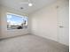 Comfortable bedroom with a large window offering scenic views and ample natural light at 1616 S Broadway # 206, Denver, CO 80210