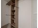 Well-organized walk-in closet featuring built-in shelving and ample storage space for clothes and accessories at 1616 S Broadway # 206, Denver, CO 80210