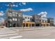 Modern multi-unit building with sleek architecture, wood accents, and street-level commercial spaces at 1616 S Broadway # 206, Denver, CO 80210