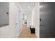 Entryway with hardwood floors, storage, bench, and access to the kitchen and living areas at 1616 S Broadway # 206, Denver, CO 80210
