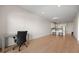 Spacious living area with hardwood floors, modern lighting, and open access to the kitchen at 1616 S Broadway # 206, Denver, CO 80210