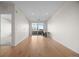 Bright living space featuring hardwood floors, large windows, and access to a balcony at 1616 S Broadway # 206, Denver, CO 80210