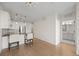Open living area with kitchen, hardwood floors, and bright natural light at 1616 S Broadway # 206, Denver, CO 80210
