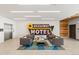 Inviting lobby area with stylish seating, eye-catching Broadway Motel sign, and elevator access at 1616 S Broadway # 206, Denver, CO 80210