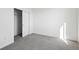 A bright bedroom with gray carpet and a closet with sliding doors at 1238 Penner Dr, Erie, CO 80026