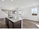 Bright kitchen features a large island, modern lighting, and an open layout at 1238 Penner Dr, Erie, CO 80026