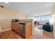 Efficient kitchen featuring stainless steel appliances and hardwood floors flowing into the bright and open living area at 1196 N Grant St # 407, Denver, CO 80203