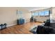 A well-lit living room featuring hardwood floors, large windows with views, and stylish modern furniture at 1196 N Grant St # 407, Denver, CO 80203