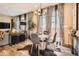 Beautiful dining area features stylish decor, modern light fixture, and hardwood floors with modern decor at 1519 S Dayton St, Denver, CO 80247