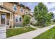 Attractive townhome featuring manicured front yard and a welcoming facade at 1519 S Dayton St, Denver, CO 80247