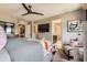 Comfortable main bedroom with ceiling fan and attached bathroom at 1519 S Dayton St, Denver, CO 80247
