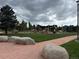 Community playground featuring play structures and green space at 1519 S Dayton St, Denver, CO 80247