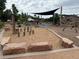 The image shows the community playground with a sand pit, swings, and slide at 1519 S Dayton St, Denver, CO 80247