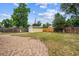Spacious backyard features a detached garage and brick-paved area at 2731 S Pearl St, Englewood, CO 80113