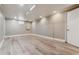 Finished basement with vinyl floors and newly painted walls at 2731 S Pearl St, Englewood, CO 80113