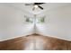 Sunny bedroom with hardwood floors, and corner windows offering pleasant views at 2731 S Pearl St, Englewood, CO 80113